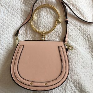 Pink bracelet crossbody purse